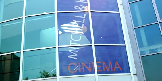 Main image: Mitchell and Kenyon cinema sign in UCLan Foster Building window.