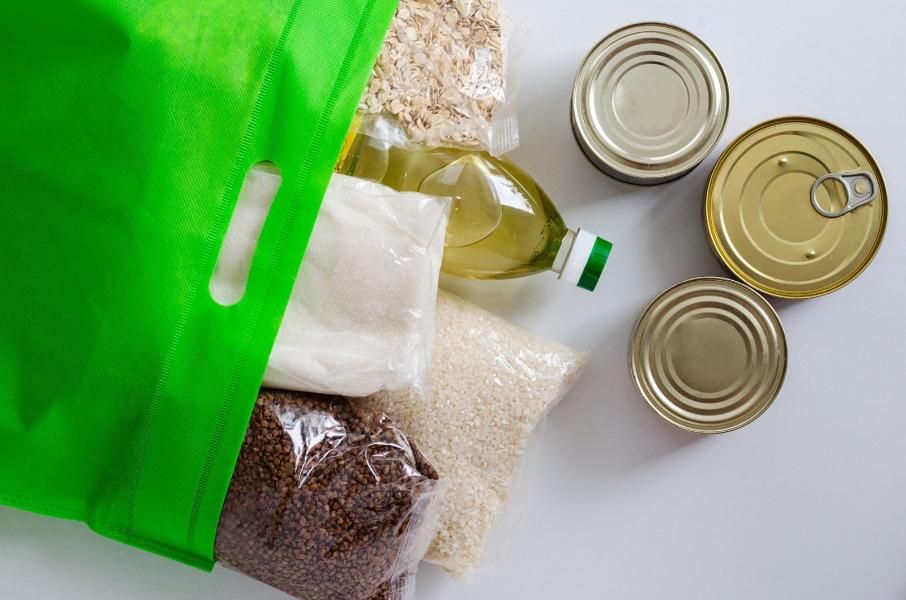 Shelf-stable products packaged in a green bag. canned food and cereals