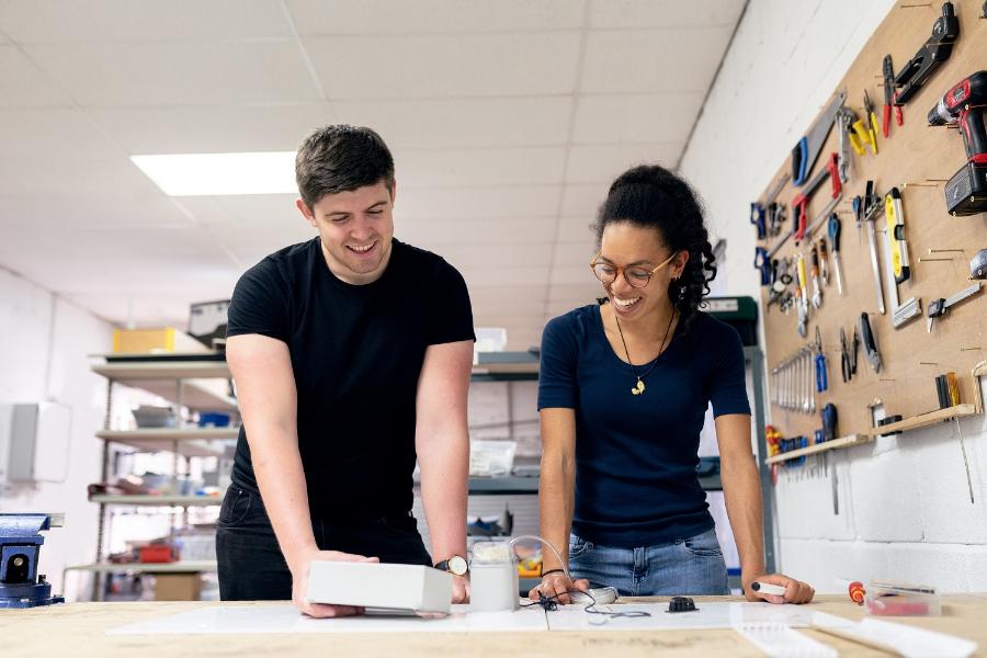 A man and women in a engineers workshop