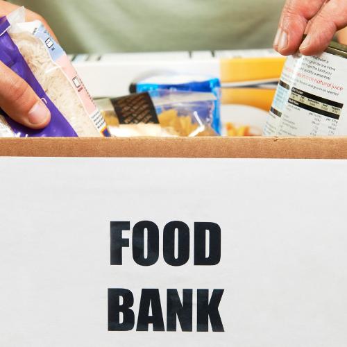 A box of food with the words Food Bank on it.