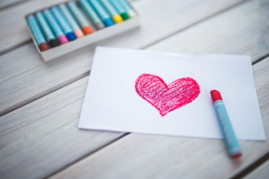 A heart on paper used by pastel crayons