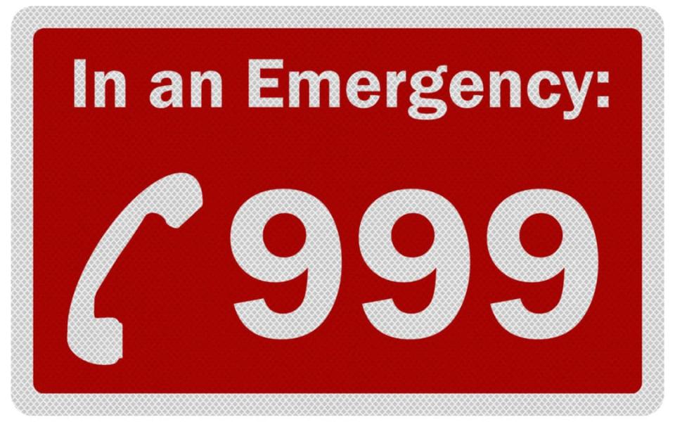 In an emergency call 999 sign