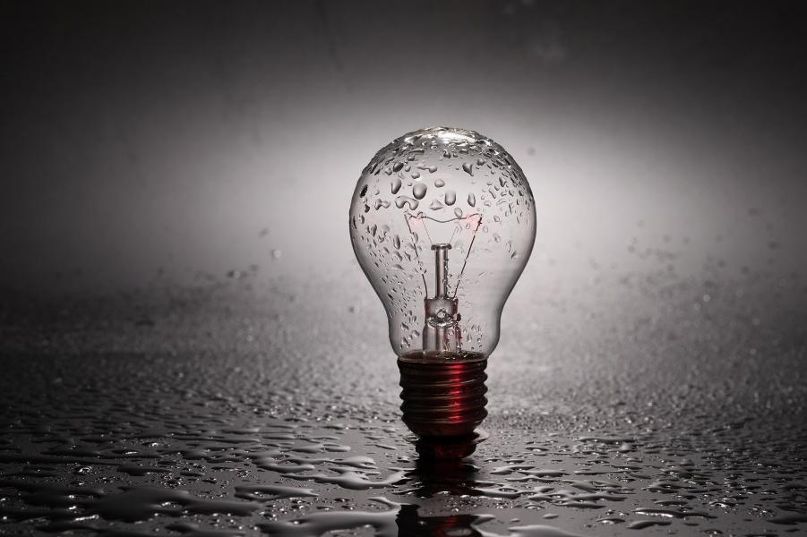 A light bulb on a black background