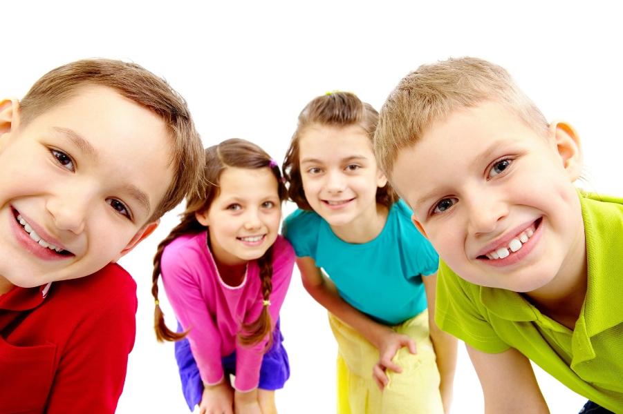 A group of young children smiling for the camera